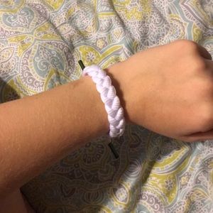 New white rastaclat bracelet with green accents